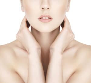 woman with her hands near her neck
